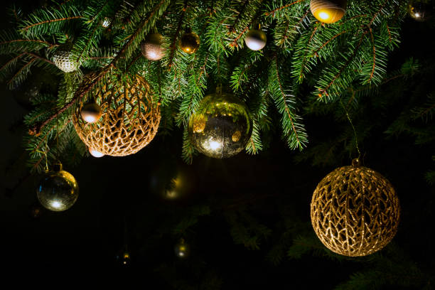 istock Fir branch with balls and festive lights 1092118132