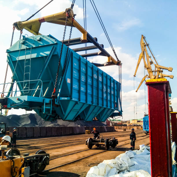 Raising the hopper car for unloading on a cargo ship. Lifting operations in the port.