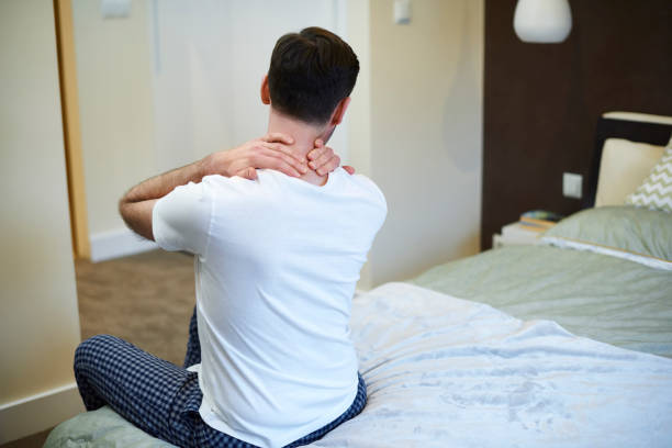 istock Rear view of man suffering from neckache 1092121652