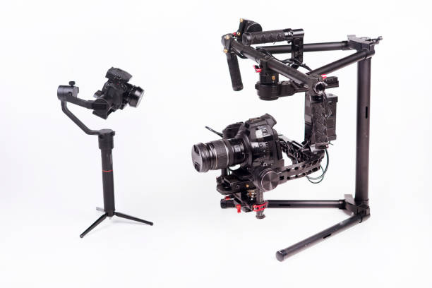 istock System stabilization video camera and lens on steady equipment support such as gimbal steady or stabilized. White background 1092130058