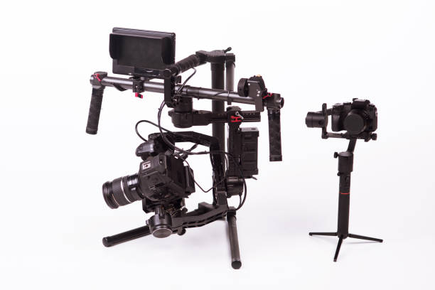 istock System stabilization video camera and lens on steady equipment support such as gimbal steady or stabilized. White background 1092130064
