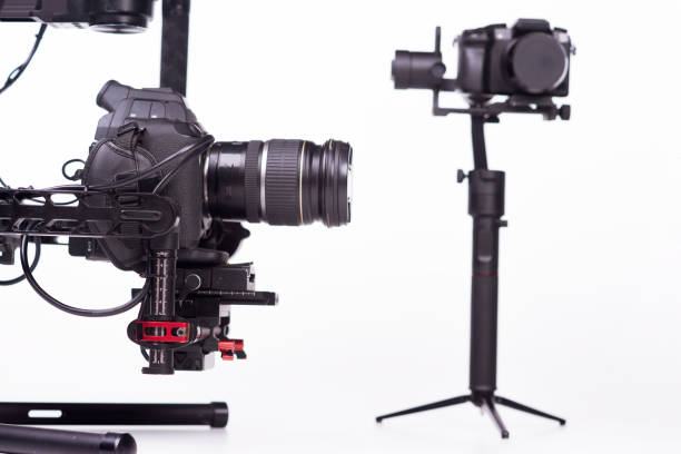 istock System stabilization video camera and lens on steady equipment support such as gimbal steady or stabilized. White background 1092130116