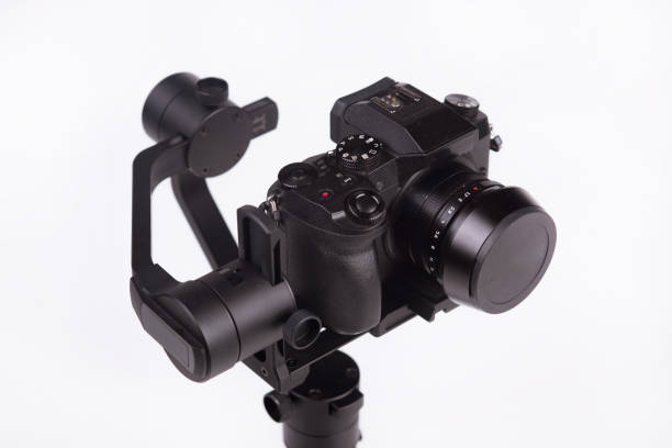 istock System stabilization video camera and lens on steady equipment support such as gimbal steady or stabilized. White background 1092130296