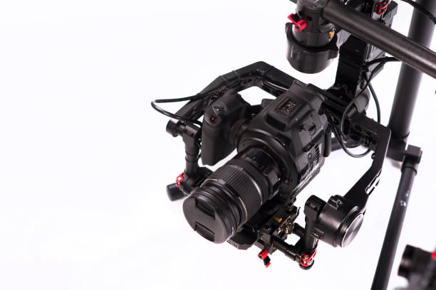 istock System stabilization video camera and lens on steady equipment support such as gimbal steady or stabilized. White background 1092130370