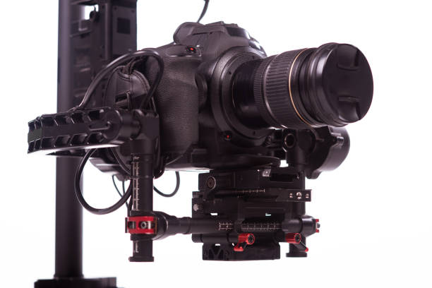 istock System stabilization video camera and lens on steady equipment support such as gimbal steady or stabilized. White background 1092130412