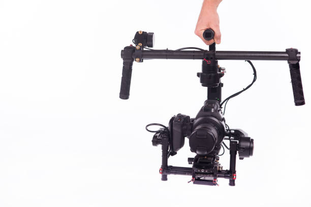 istock System stabilization video camera and lens on steady equipment support such as gimbal steady or stabilized. White background 1092130480