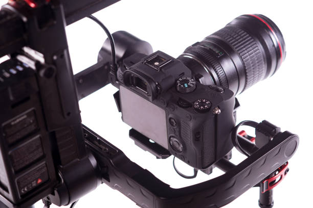 istock System stabilization video camera and lens on steady equipment support such as gimbal steady or stabilized. White background 1092130484