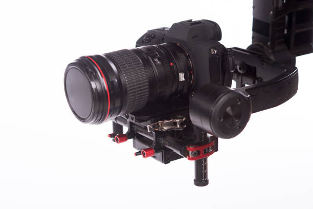 istock System stabilization video camera and lens on steady equipment support such as gimbal steady or stabilized. White background 1092130590