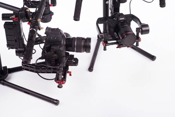 istock System stabilization video camera and lens on steady equipment support such as gimbal steady or stabilized. White background 1092130630