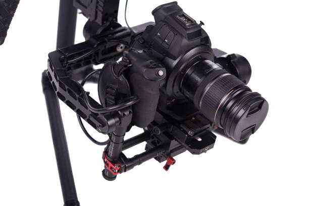 istock System stabilization video camera and lens on steady equipment support such as gimbal steady or stabilized. White background 1092130748