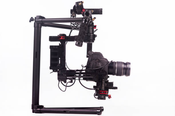 istock System stabilization video camera and lens on steady equipment support such as gimbal steady or stabilized. White background 1092130804