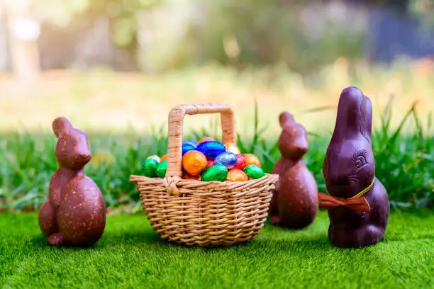 Photo of Chocolate Easter bunny with basket full of eggs