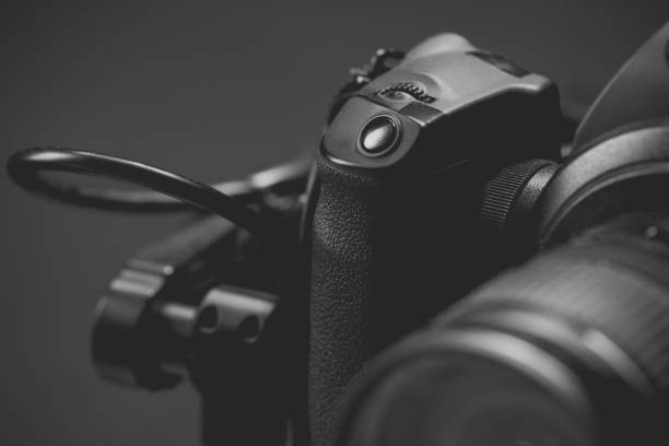 istock System stabilization video camera and lens on steady equipment support such as gimbal steady or stabilized. Black background 1092134686