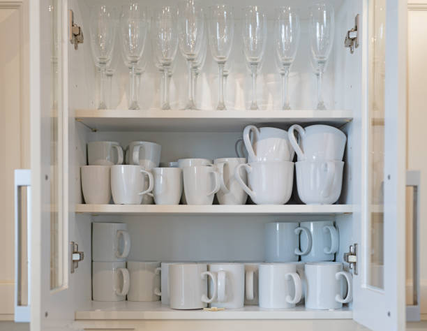 istock Cupboard full of white mugs 1092135446