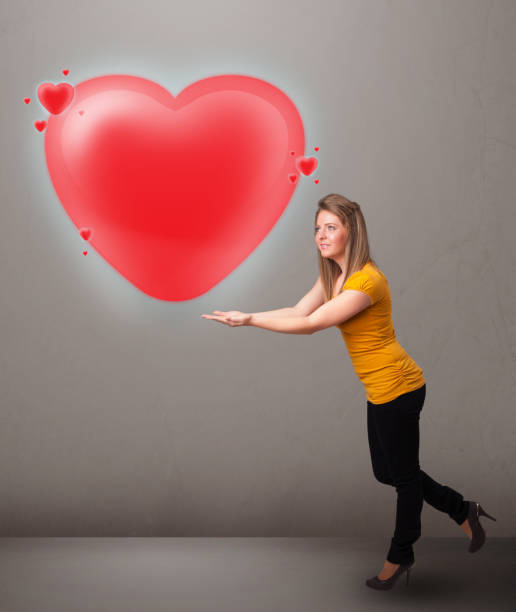 istock Young lady holding lovely 3d red heart 1092136318