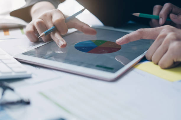 istock Businesswoman and partner hand using digital tablet and making presentation business strategy. 1092136448