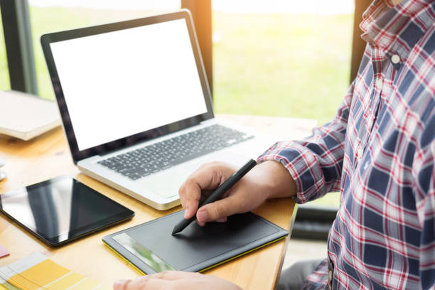 istock Midsection Of Businessman Using Digital Tablet In Office 1092136562