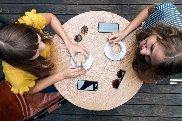 istock Relaxing women enjoying coffee together 1092136976
