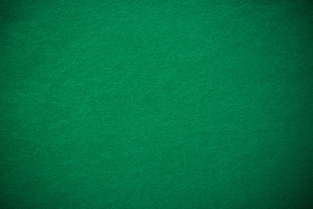 Empty green casino poker table cloth with spotlight stock photo