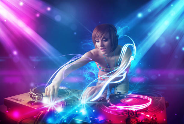 istock Energetic Dj girl mixing music with powerful light effects 1092140430