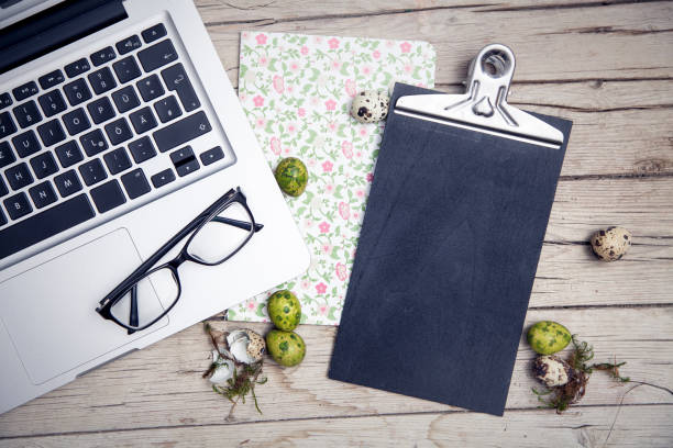 istock High Angle View Of Laptop With Personal Accessories On Table During Easter 1092143560