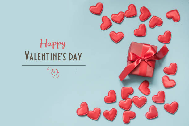 istock Valentine's card with gifts and red hearts. Space for text. 1092145358