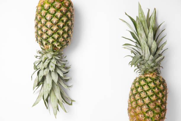 sweet,tasty organic pineapples on white  background