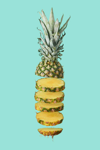 istock sliced sweet organic pineapple isolated on turquoise 1092152112