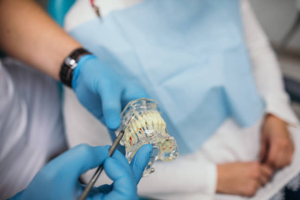 istock Dentist holding dental prosthetics teeth 1092153586