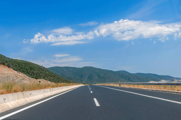 istock Highway traffic empty road street jurney with blue sky 1092153822