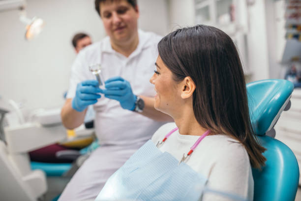 istock Young woman at the dentist 1092154334