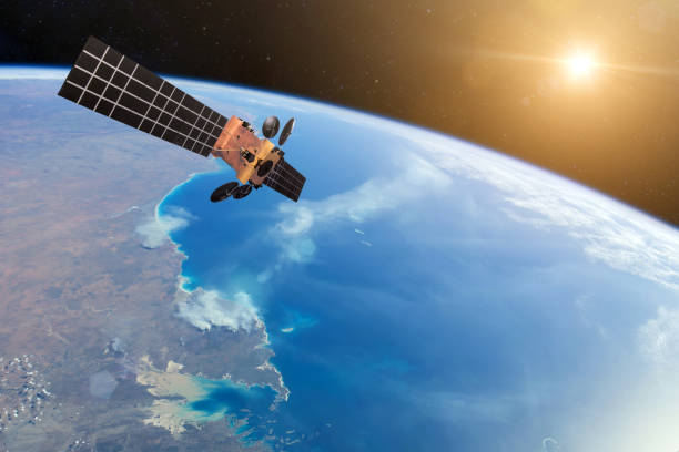 istock Space satellite orbiting the earth and bright lights Sun. Elements of this image furnished by NASA 1092156406