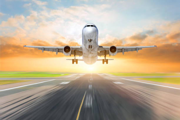 istock Airplane is take off off at sunset sky. 1092156654