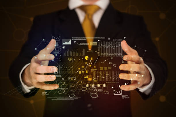 istock Businessman holding business plan graphics 1092160662