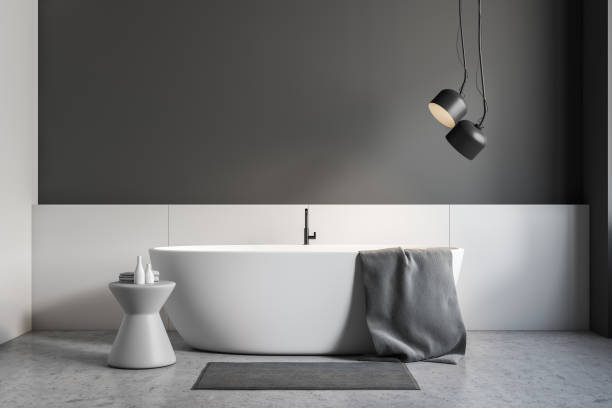 istock Gray and white bathroom interior, white tub 1092160726