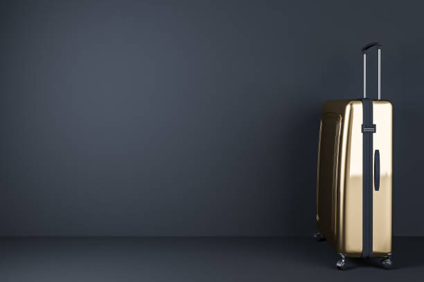 istock Gold suitcase standing in black room, side 1092162388