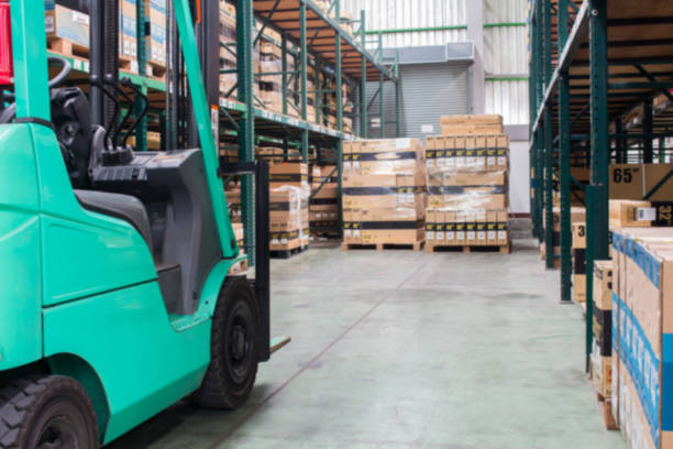 istock warehouse. Rows of shelves with boxes(Blur picture) 1092162936