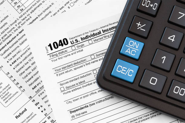istock US 1040 Tax Form and calculator 1092165908