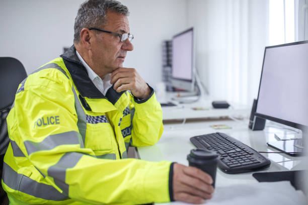 istock British police officer reading a report 1092167918