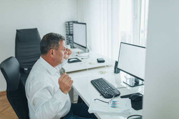 istock Senior businessman celebrating at the office 1092167994