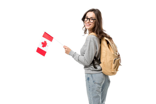 istock female student with canadian flag and backpack looking at camera isolated on white 1092168328