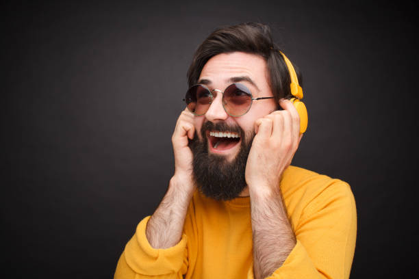 istock Bright hipster man enjoying music 1092169318