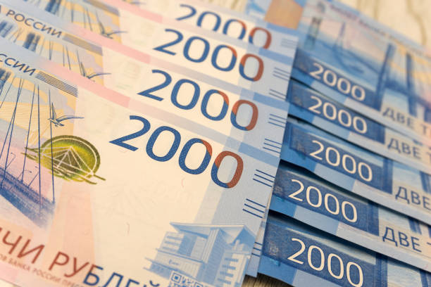 istock Sandwiches with one thousand and five thousand rubles bills. Business concept . 1092170776