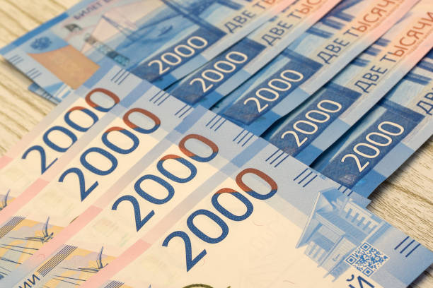 istock Rows of stacks of dollars in hundred dollar banknotes on table . 1092170822