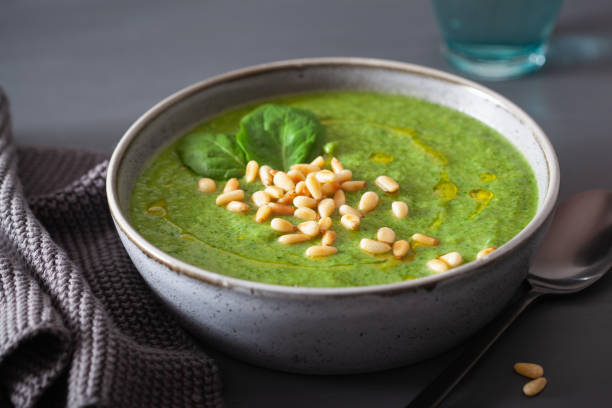 istock green creamy cauliflower spinach soup on gray background 1092171802