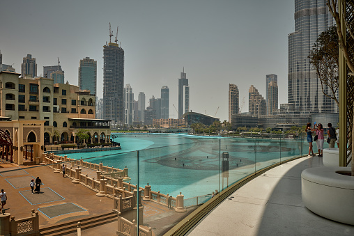 Dubai, UAE - August 14, 2018: Balcony city view to The Dubai Fountain and Burj Khalifa from Dubai Shopping Mall