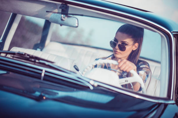 istock Adorable Female Drives Vintage Cabriolet 1092173604