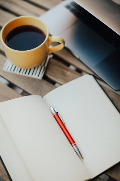 istock Technology and coffee on a wooden table 1092176374