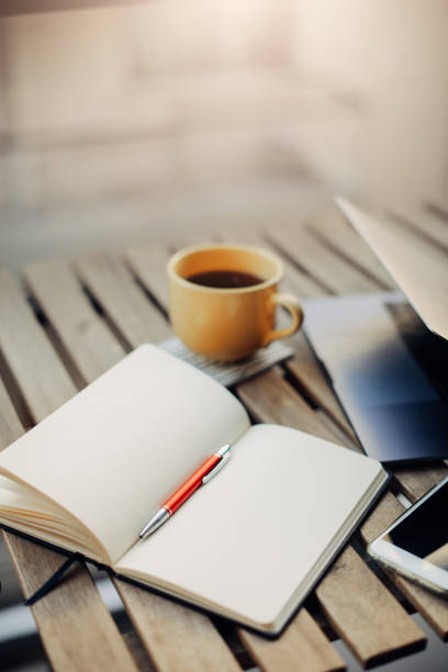 Technology and coffee on a wooden table