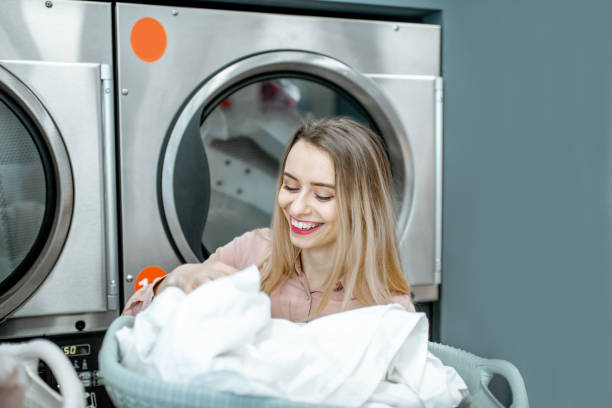istock Happy woman in the laundry 1092178986